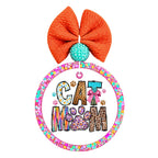 Cat Mom colorful animal print typography with paw prints and a pink bow.