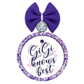 Gigi Knows Best purple script design with pink hearts.