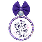 Gigi Knows Best purple script design with pink hearts.