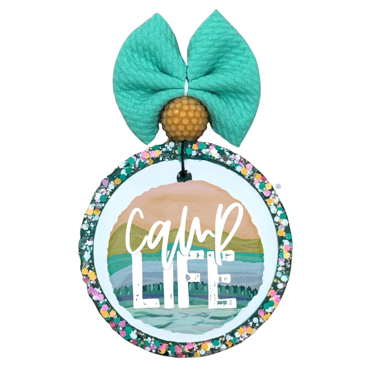 Camp Life graphic with layered mountain, lake and camper landscape