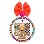 Camping Girl graphic with campfire, camouflage bow and leopard bow panels