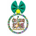 Cooking is love made edible text with colorful kitchen utensils and cooking icons.