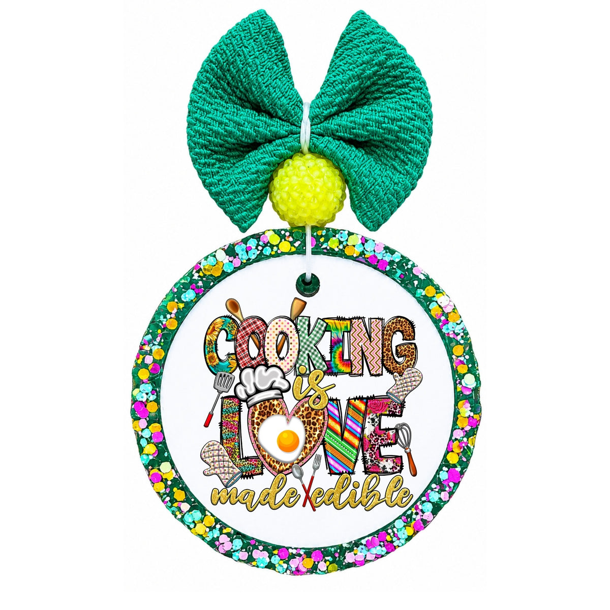 Cooking is love made edible text with colorful kitchen utensils and cooking icons.