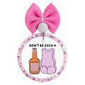 Don't be such a text above an orange bottle and pink gummy bear graphic.