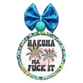Hakuna ma fuck it text with palm trees and colorful background shapes.