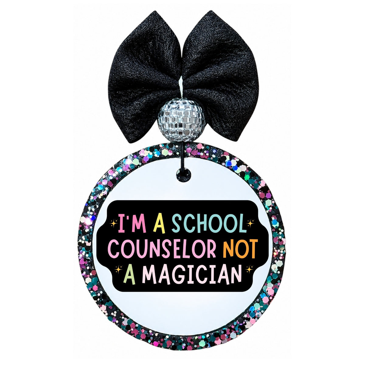 I'm a school counselor not a magician text in colorful lettering on a black background.