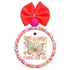 Shine so bright it burns their eyes text with a butterfly and floral accents.