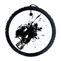 Black football helmet silhouette with paint splatter background.