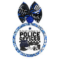 My Heart Belongs to a Police Officer text with police vest, duty belt, boots, handcuffs, radio, and coffee cup.
