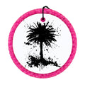 Black palm tree silhouette with paint splatter accents.