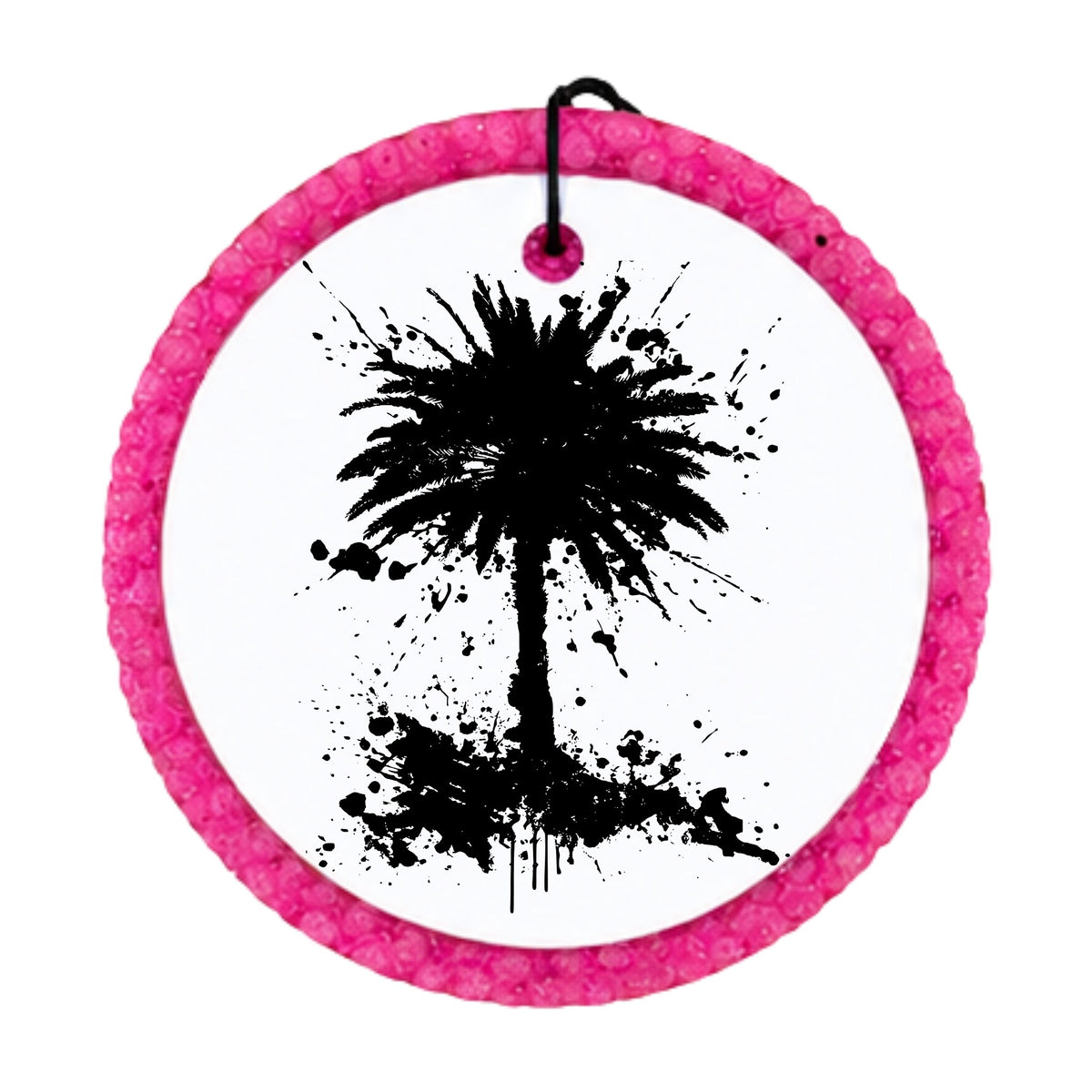 Black palm tree silhouette with paint splatter accents.