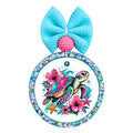 Colorful sea turtle swimming with pink tropical flowers, starfish, and ocean accents.