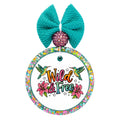 Wild & Free text with two hummingbirds, pink flowers, and star accents.
