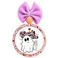 Basic Boo text with a smiling ghost holding a tumbler and small bats.