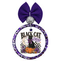 Black Cat Energy text with black cat on a pumpkin, crescent moon, purple flowers, and checker accents.