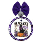 Black Cat Energy text with black cat on a pumpkin, crescent moon, purple flowers, and checker accents.