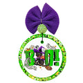 Boo text with a witchy black cat riding a broom, bats, pumpkins, moon, and spooky accents.