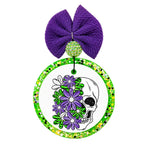 Half skull design covered with purple and white flowers and bright green leaves.