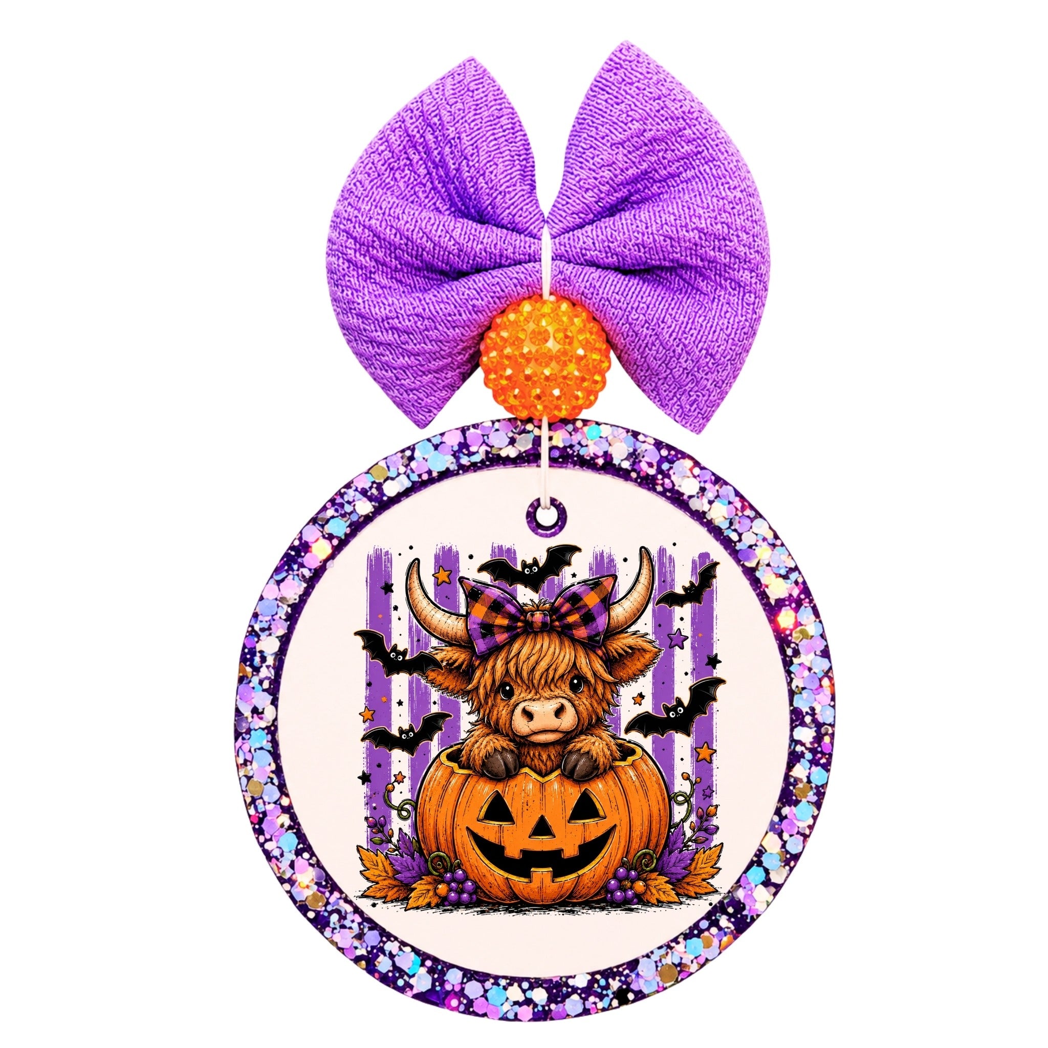 Halloween Highland cow sitting inside a jack-o-lantern with purple stripes, bats, stars, and fall accents.