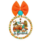 Thankful and Blessed text with fall gnomes, pumpkins, autumn leaves, and an orange pickup truck.