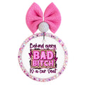 Bold pink and leopard quote saying Behind every bad bitch is a car seat.