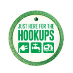 RV camping design saying Just here for the hookups with electric, water and camper icons.