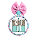 Gigi Life design with leopard print, aqua color block, and a small heart.