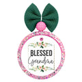 Blessed Grandma lettering framed by soft pink and white floral greenery.