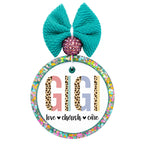 Gigi lettering with leopard print and pastel color blocks above the words love, cherish, care.