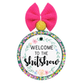 Welcome to the shitshow quote surrounded by soft floral accents.