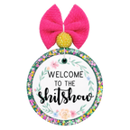 Welcome to the shitshow quote surrounded by soft floral accents.