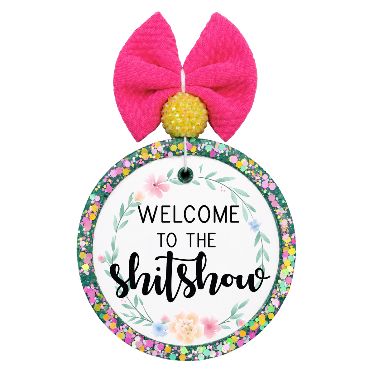 Welcome to the shitshow quote surrounded by soft floral accents.