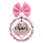 Chaos Coordinator lettering with pink brush strokes and gold accents.