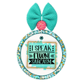 I Speak Fluent Sarcasm lettering on a turquoise background with gold border accents.
