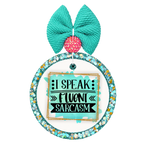 I Speak Fluent Sarcasm lettering on a turquoise background with gold border accents.
