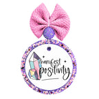 Crystal design with the words Manifest Positivity.