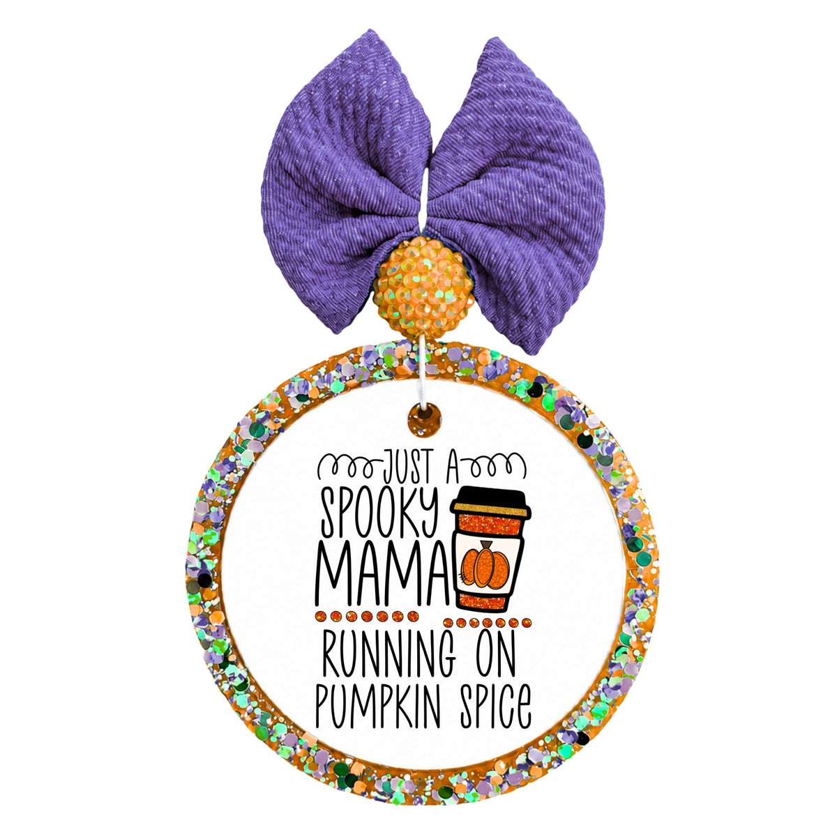 Just a spooky mama running on pumpkin spice lettering beside a takeaway cup with a pumpkin.