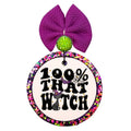 100% that witch in bold black lettering with a purple witch hat and small stars.