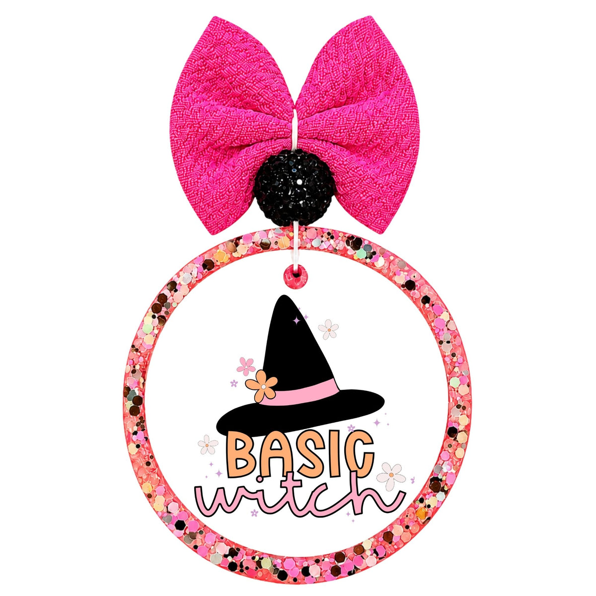 Basic witch in orange and pink lettering below a black witch hat with a pink band and flowers.