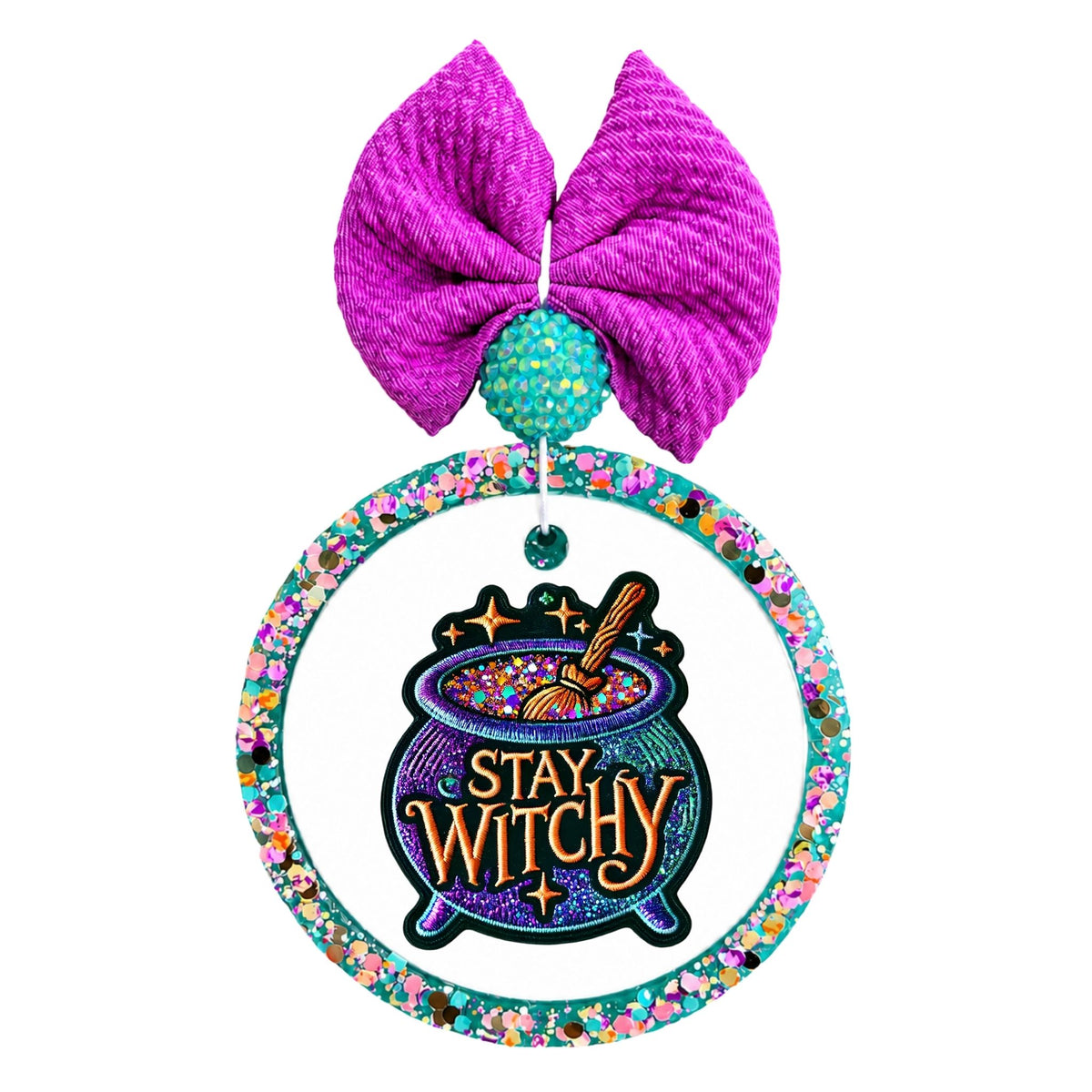 Stay witchy lettering on a colorful bubbling cauldron with a stirring spoon and stars.