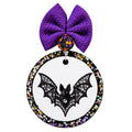 Black bat with outstretched wings filled with silver jewel-style details.