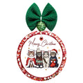 Meowy Christmas lettering above four cats dressed in festive winter clothes, with gold stars.