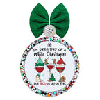 Three festive wine glasses decorated with a tree, reindeer, and Santa hat, with white Christmas but red is also fine wording.