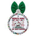 Three dancing Santas in pink and green with there’s some ho’s in this house lettering.