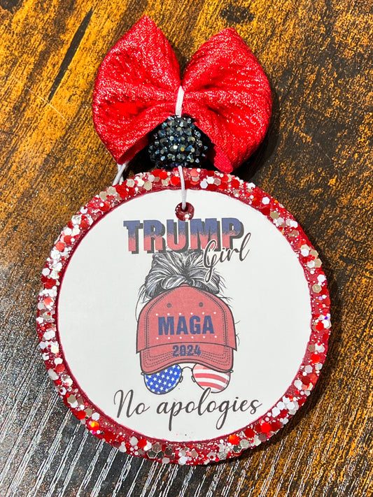 A red and clear beaded air freshener with a 'Trump Girl' logo and the text 'MAGA 2024' on a white label, surrounded by red beads.