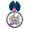 A circular hanging car air freshener featuring Good Vibes Only in colorful floral lettering.