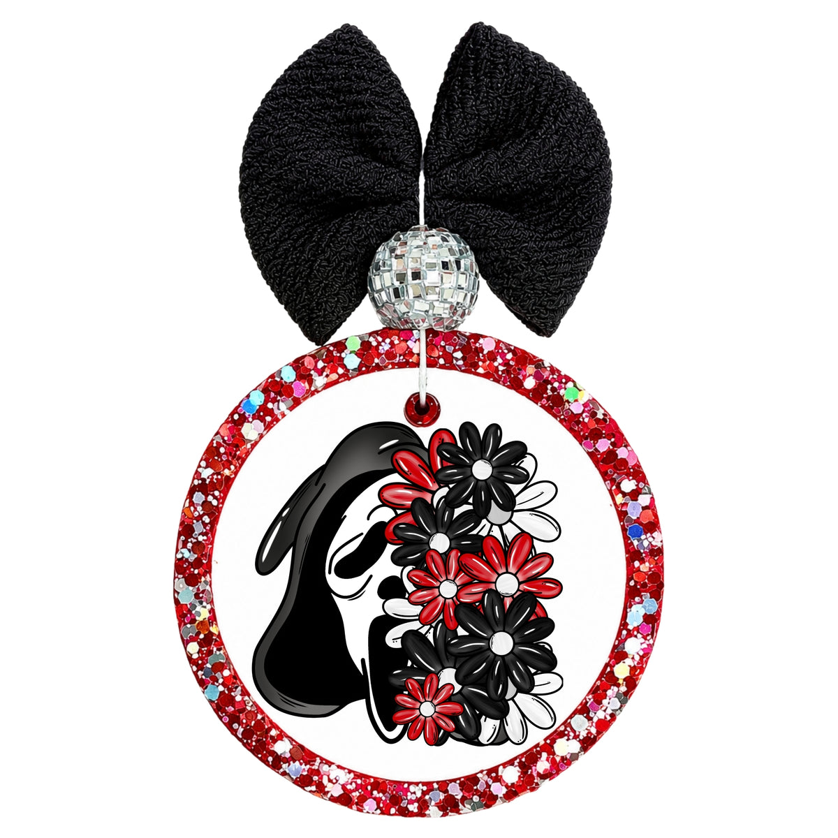 A circular hanging car air freshener shown with a black textured bow and silver beaded center, featuring a bold black-and-white ghost silhouette surrounded by red, black and white flowers.