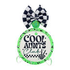Cool Aunts Club in black lettering with green-accented script, checkerboard and a skeleton hand.
